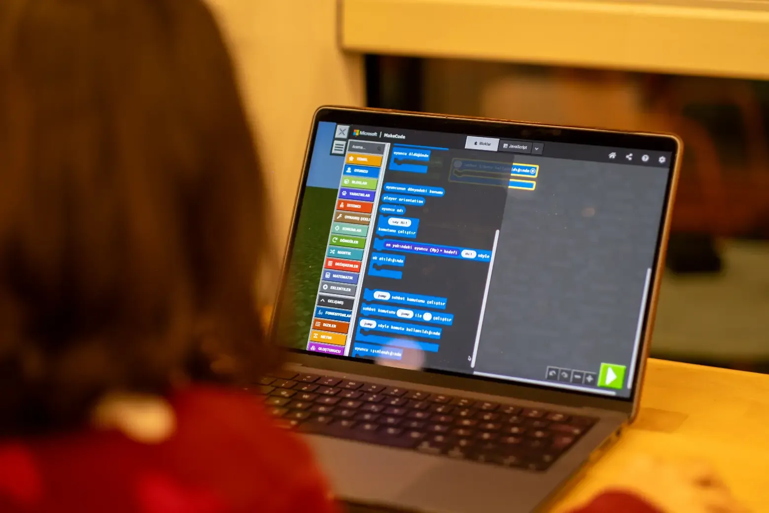 Student coding a Scratch game project