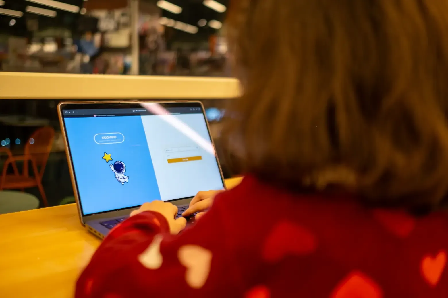 Student coding Python scripts online